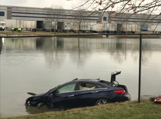 Vehicle ended up in a retention pong following a crash in Plainfield Tuesday morning, officer saves woman from drowning
