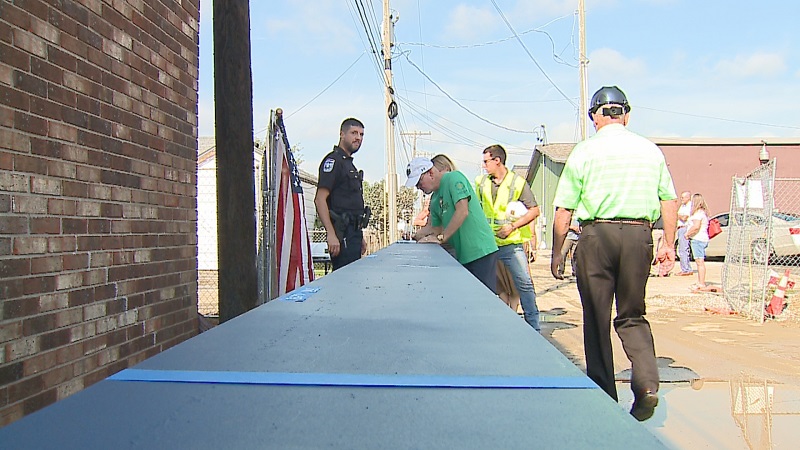 Beech Grove business owners sign steel beam used in new police station